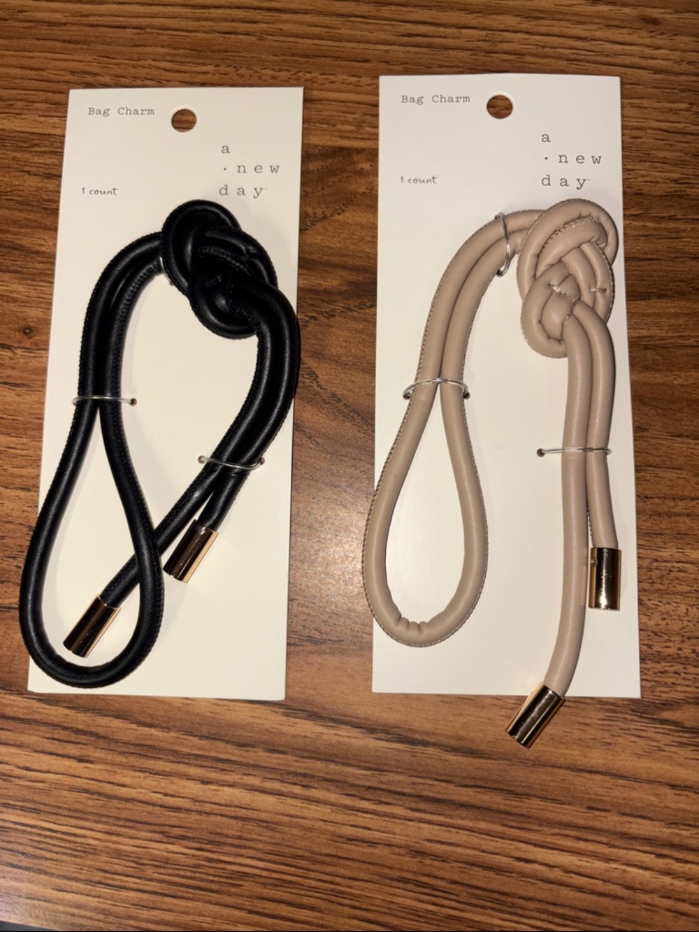a new day Black and Taupe Knot Strap Bag Charms with Gold Accents